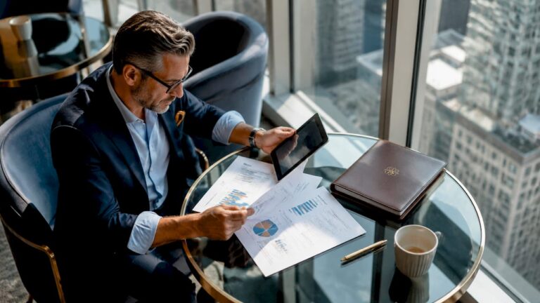 Business consultant reviewing exit-ready systems documents